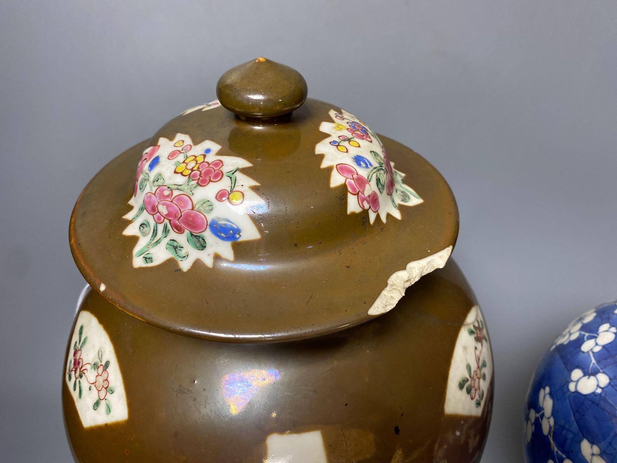 Two Chinese Kangxi period blue and white vases and a Qianlong Batavia vase and cover, largest 36cm high including the cover